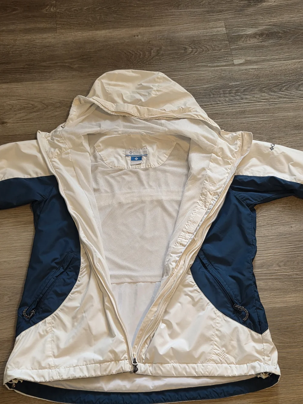 Columbia This jacket is a white and navy blue Columbia windbreaker
